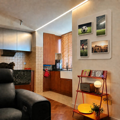 Pintura modular digital displays showing sports photos on a modern apartment wall.